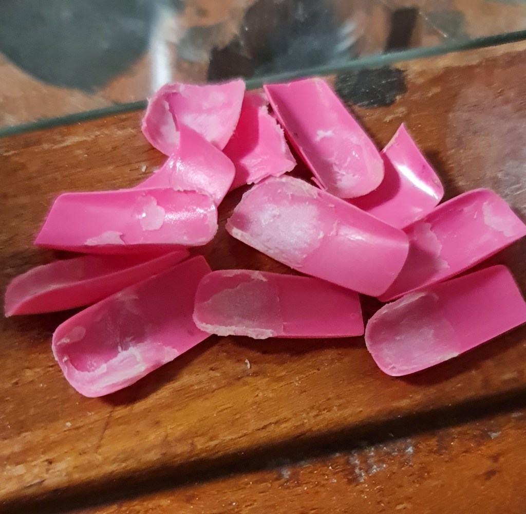 Sad pile of removed acrylic nails