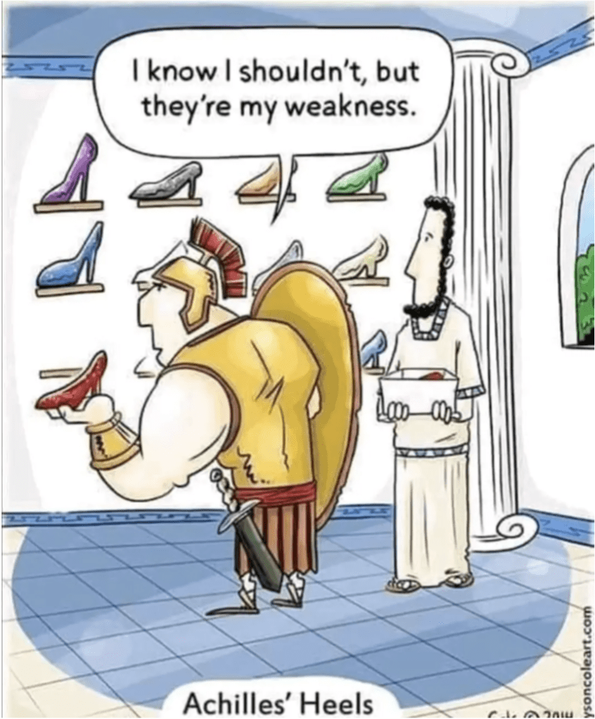Achilles is examining high-heeled shoes in a shop in ancient Greece. He says "I know I sholdn't, but they are my weakness". The image caption reads "Achilles' Heels"